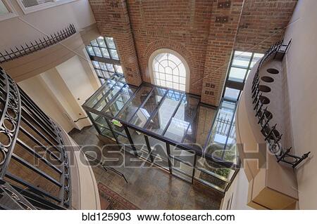 Stock Image - High angle view of lobby area in office building. Fotosearch