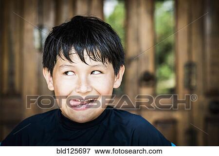 Hispanic boy making face View Large Photo Image Stock Photo - Hispanic boy making face. Fotosearch