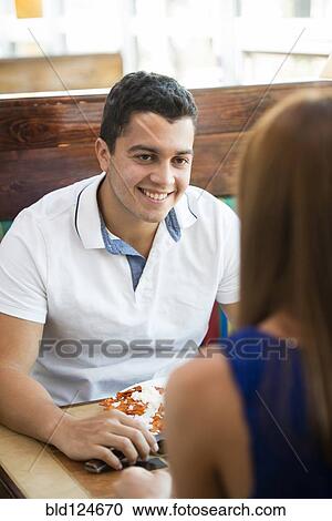 Hispanic couple eating together at cafe View Large Photo Image Stock Image - Hispanic couple eating together at cafe. Fotosearch