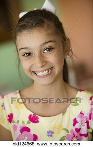 Stock Photo - Hispanic girl smiling. Fotosearch