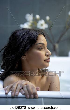 Hispanic woman relaxing in bath View Large Photo Image Stock Photo - Hispanic woman relaxing in bath. Fotosearch