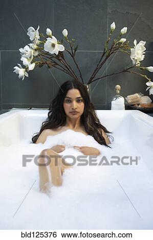 Hispanic woman relaxing in bubble bath View Large Photo Image Stock Photograph - Hispanic woman relaxing in bubble bath. Fotosearch