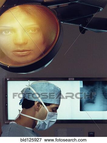 Stock Photo - Image of woman over surgeon in operating room. Fotosearch