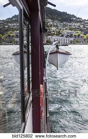 Stock Image - Lifeboat hanging from ship. Fotosearch