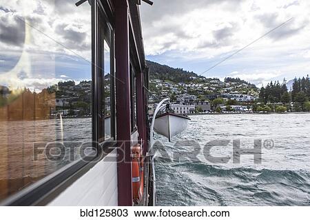 Lifeboat hanging from ship View Large Photo Image Stock Image - Lifeboat hanging from ship. Fotosearch