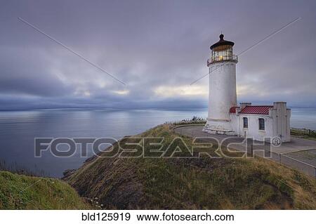 Stock Photo - Light house overlooking ocean. Fotosearch