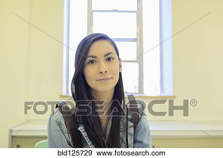 Stock Photo - Middle Eastern student sitting in classroom. Fotosearch