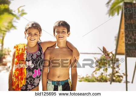 Mixed race children smiling on beach View Large Photo Image Stock Photography - Mixed race children smiling on beach. Fotosearch