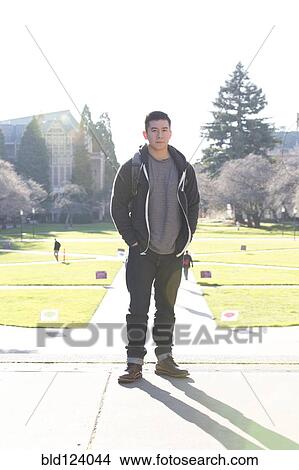 Mixed race college student smiling on campus View Large Photo Image Picture - Mixed race college student smiling on campus. Fotosearch