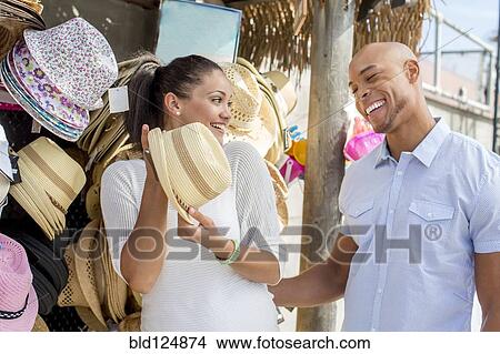 Picture - Mixed race couple shopping together. Fotosearch