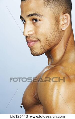Stock Image - Mixed race man smiling. Fotosearch