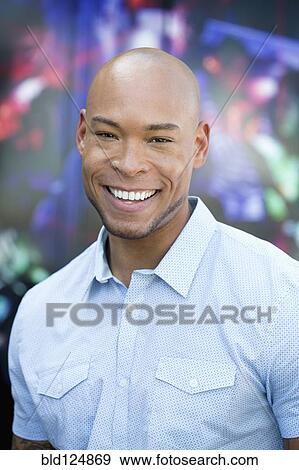 Stock Photo - Mixed race man smiling. Fotosearch