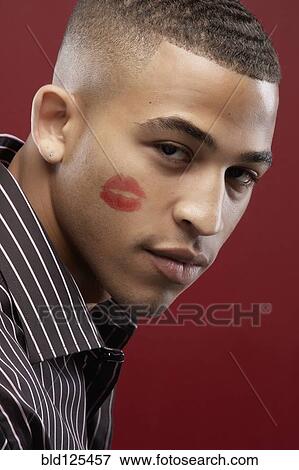 Mixed race man with lipstick kiss on cheek View Large Photo Image Stock Photo - Mixed race man with lipstick kiss on cheek. Fotosearch