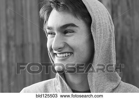 Stock Image - Mixed race teenage boy smiling. Fotosearch