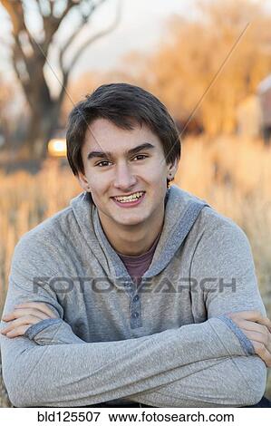Stock Photo - Mixed race teenage boy smiling. Fotosearch