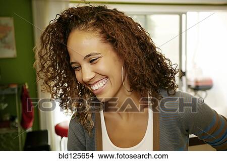 Mixed race woman laughing View Large Photo Image Picture - Mixed race woman laughing. Fotosearch