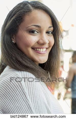 Stock Photo - Mixed race woman smiling. Fotosearch