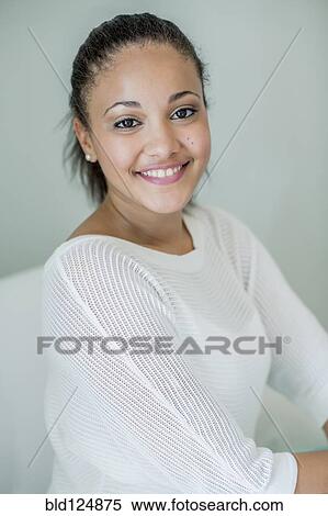 Stock Photography - Mixed race woman smiling. Fotosearch