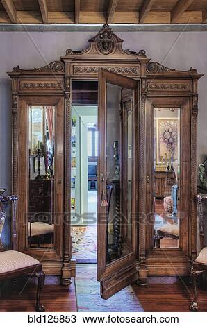 Stock Image - Ornate wardrobe with secret door. Fotosearch