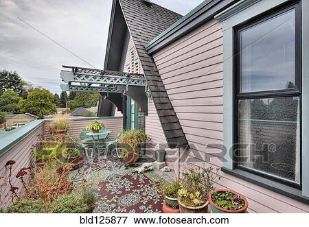 Stock Photo - Potted plants on patio. Fotosearch
