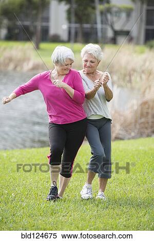 Stock Photography - Senior Caucasian women playing in park. Fotosearch