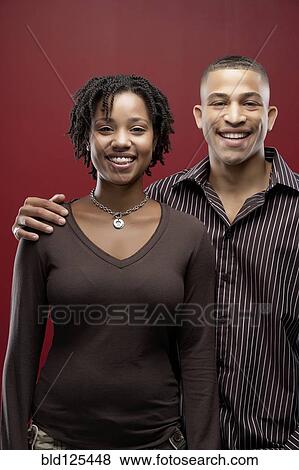 Stock Photo - Smiling couple hugging. Fotosearch