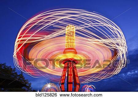 Stock Photograph - Spinning chain swing ride at Puyallup Fair, Puyallup, Washington, United States. Fotosearch