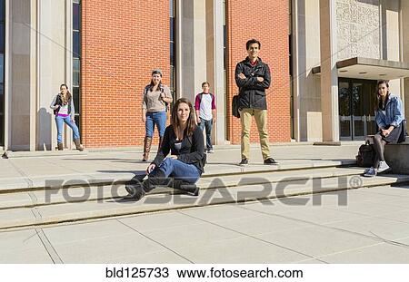 Stock Image - Students on campus steps. Fotosearch