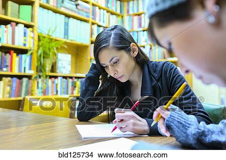 Picture - Students working in library. Fotosearch
