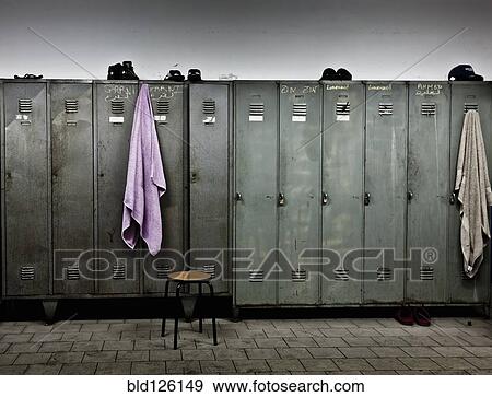 Towels hanging from lockers in locker room View Large Photo Image Stock Photo - Towels hanging from lockers in locker room. Fotosearch