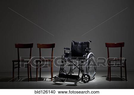Wheelchair in line of wooden chairs View Large Photo Image Stock Image - Wheelchair in line of wooden chairs. Fotosearch