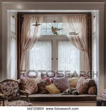 Window seat and curtains in nook View Large Photo Image Picture - Window seat and curtains in nook. Fotosearch