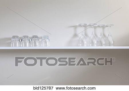 Wine and juice glasses on shelf View Large Photo Image Stock Photo - Wine and juice glasses on shelf. Fotosearch