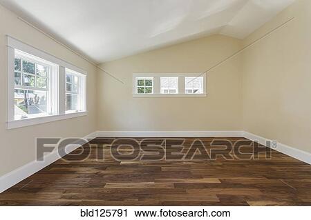 Stock Image - Wooden floor in empty bedroom. Fotosearch