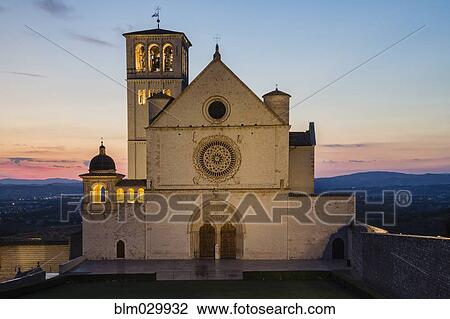 Stock Image - Basilica di San Francesco d'Assisi at sunset, Assisi, Umbria, Italy. Fotosearch