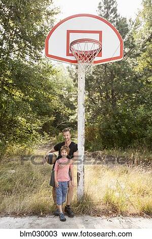 Caucasian father and son on basketball court View Large Photo Image Stock Image - Caucasian father and son on basketball court. Fotosearch
