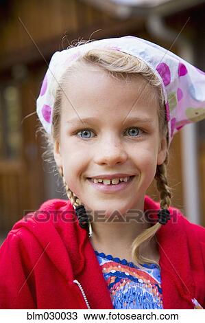 Stock Image - Caucasian girl smiling outdoors. Fotosearch