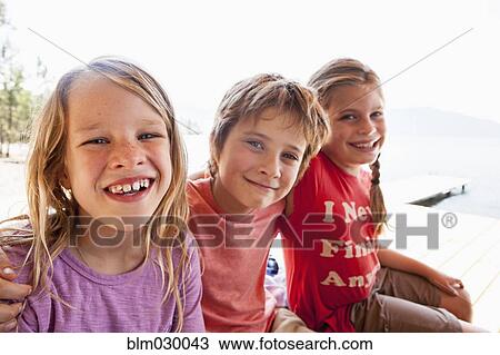 Children smiling together outdoors View Large Photo Image Stock Image - Children smiling together outdoors. Fotosearch