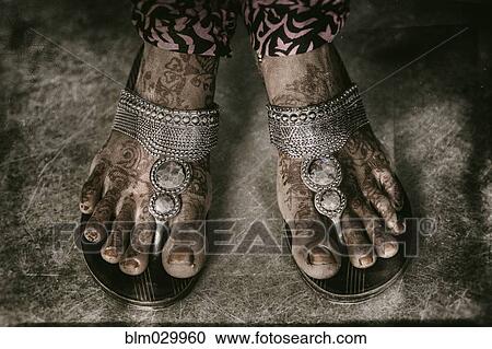 Stock Image - Close up of henna tattooed feet. Fotosearch