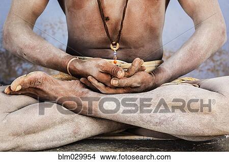 Picture - Close up of Sadhu in lotus position. Fotosearch