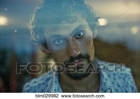 Stock Image - Close up portrait of serious man with beard. Fotosearch