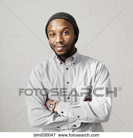 Close up portrait of smiling Black man wearing stocking-cap View Large Photo Image Stock Photo - Close up portrait of smiling Black man wearing stocking-cap. Fotosearch