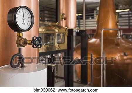 Gauge and copper stills in distillery View Large Photo Image Stock Image - Gauge and copper stills in distillery. Fotosearch