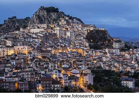Hillside town at dusk, Nicosia, Sicily, Italy View Large Photo Image Stock Photo - Hillside town at dusk, Nicosia, Sicily, Italy. Fotosearch