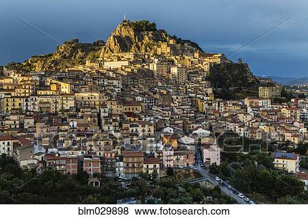Hillside town at sunset, Nicosia, Sicily, Italy View Large Photo Image Stock Photo - Hillside town at sunset, Nicosia, Sicily, Italy. Fotosearch