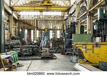 Men working in metal shop View Large Photo Image Stock Image - Men working in metal shop. Fotosearch