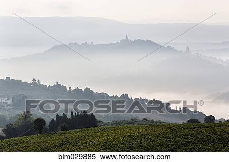 Morning fog over hills and town, Todi, Umbria, Italy View Large Photo Image Stock Photography - Morning fog over hills and town, Todi, Umbria, Italy. Fotosearch