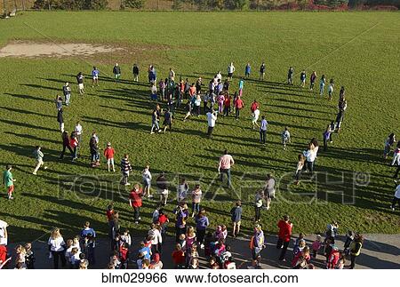 People forming heart-shape in park View Large Photo Image Stock Photograph - People forming heart-shape in park. Fotosearch