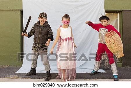 Stock Image - Portrait of children in costumes outdoors. Fotosearch