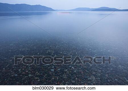 Rocks on bottom of still rural lake View Large Photo Image Stock Photo - Rocks on bottom of still rural lake. Fotosearch